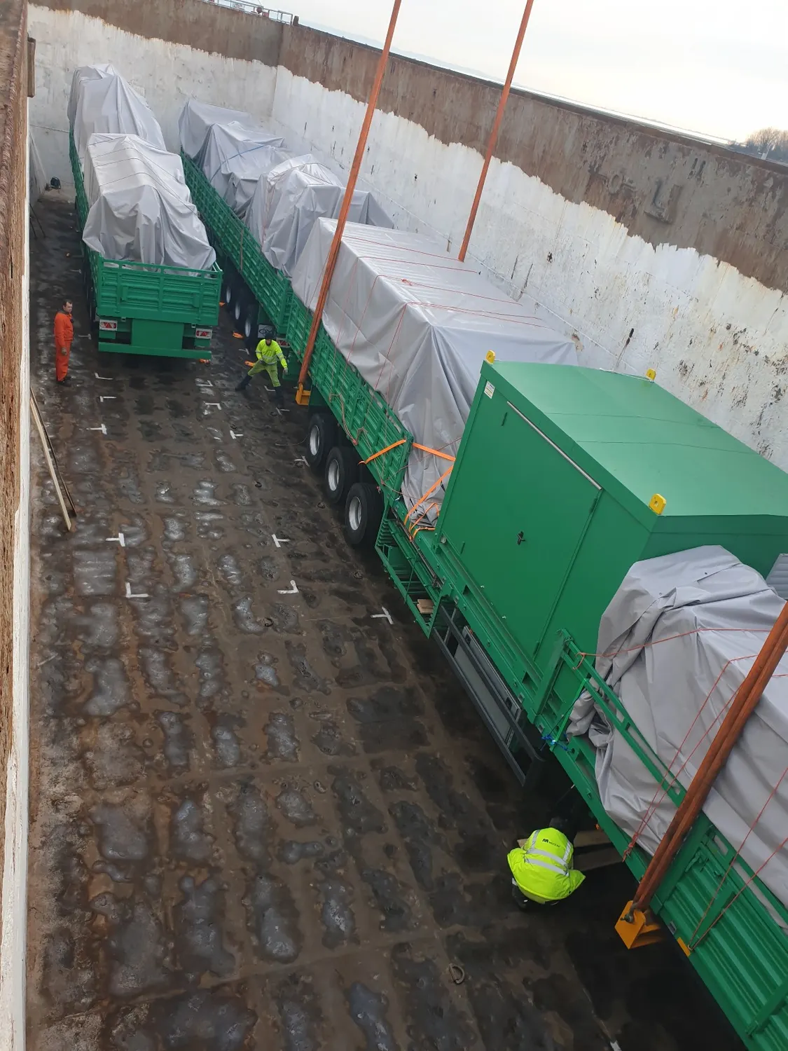 Covered trailers stowed inside a ship’s hold